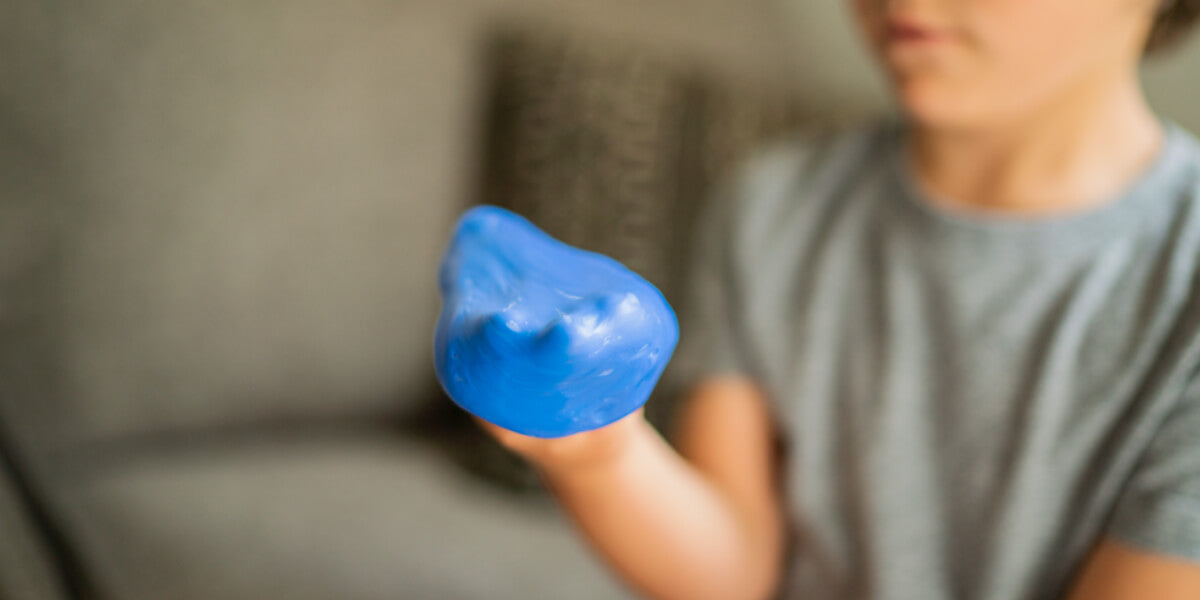 Kid holding therapy putty