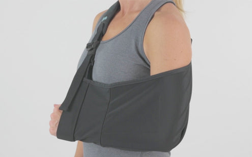 Woman using arm sling