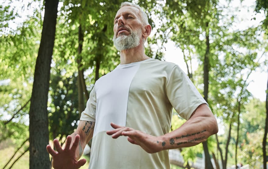 Man practicing breathing yoga