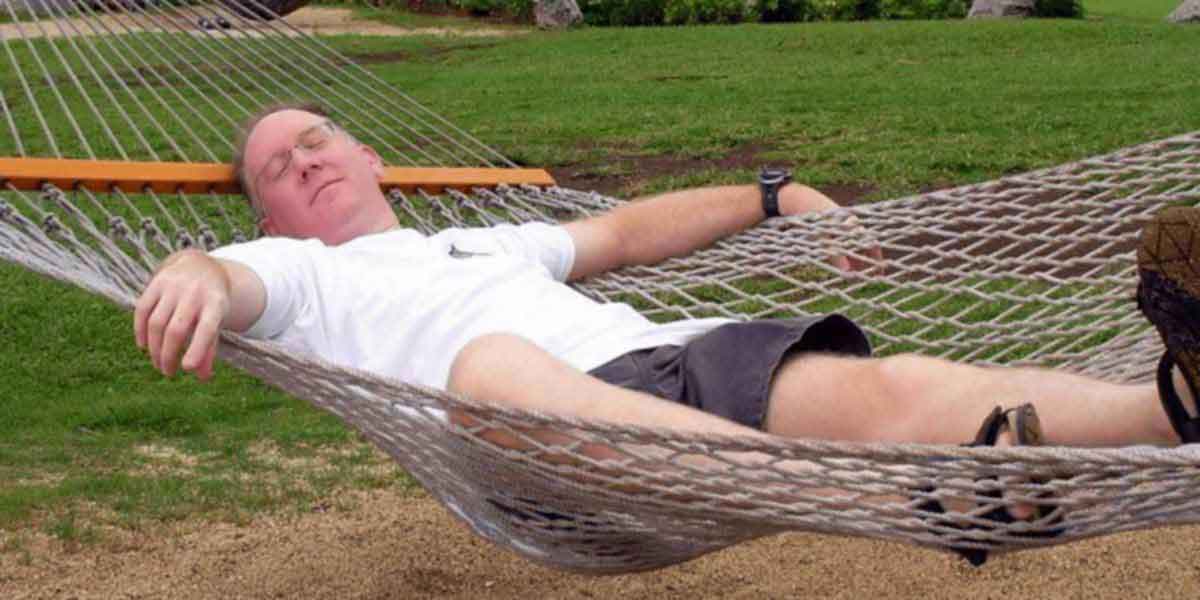 Man relaxing in hammock