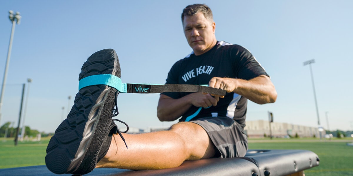 Man stretching with straps