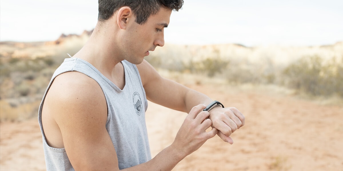 Man setting-up fitness tracker