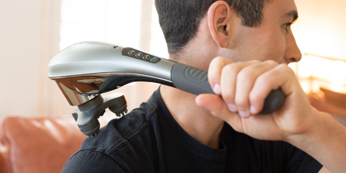 Man using handheld massager