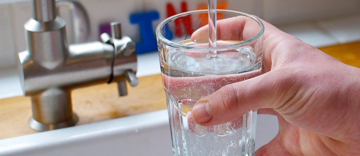 Pouring water into a glass