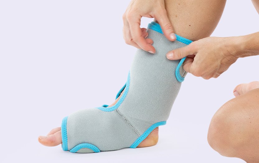 Right foot wearing ankle ice pack