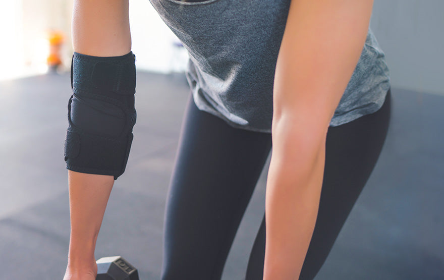 Woman wearing Elbow Brace