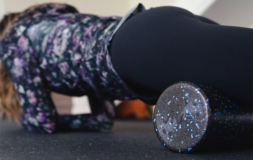 Woman using foam roller massage