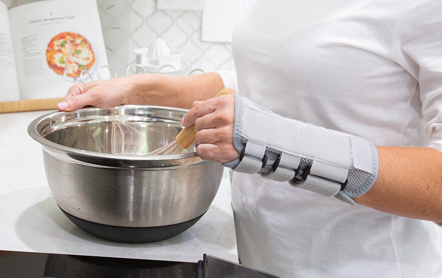 Wearing wrist brace cooking