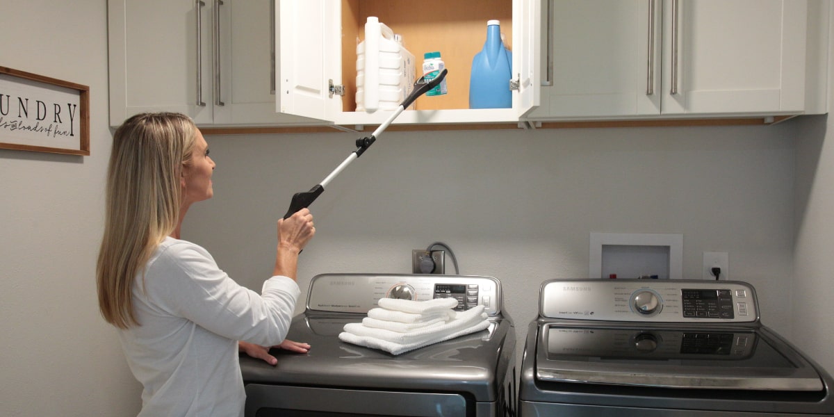 woman using reacher grabber