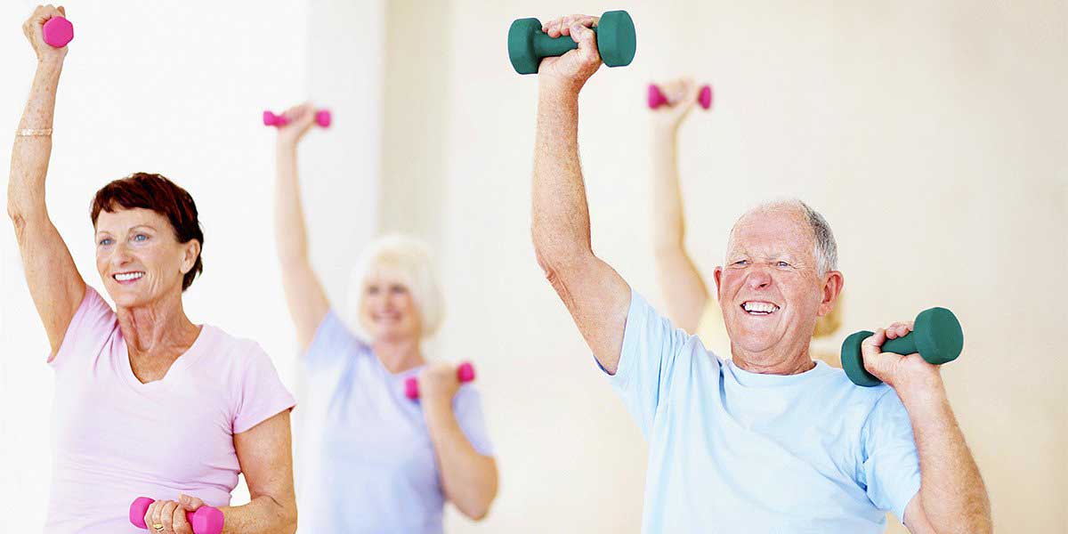 group of senior lifting dumbbells