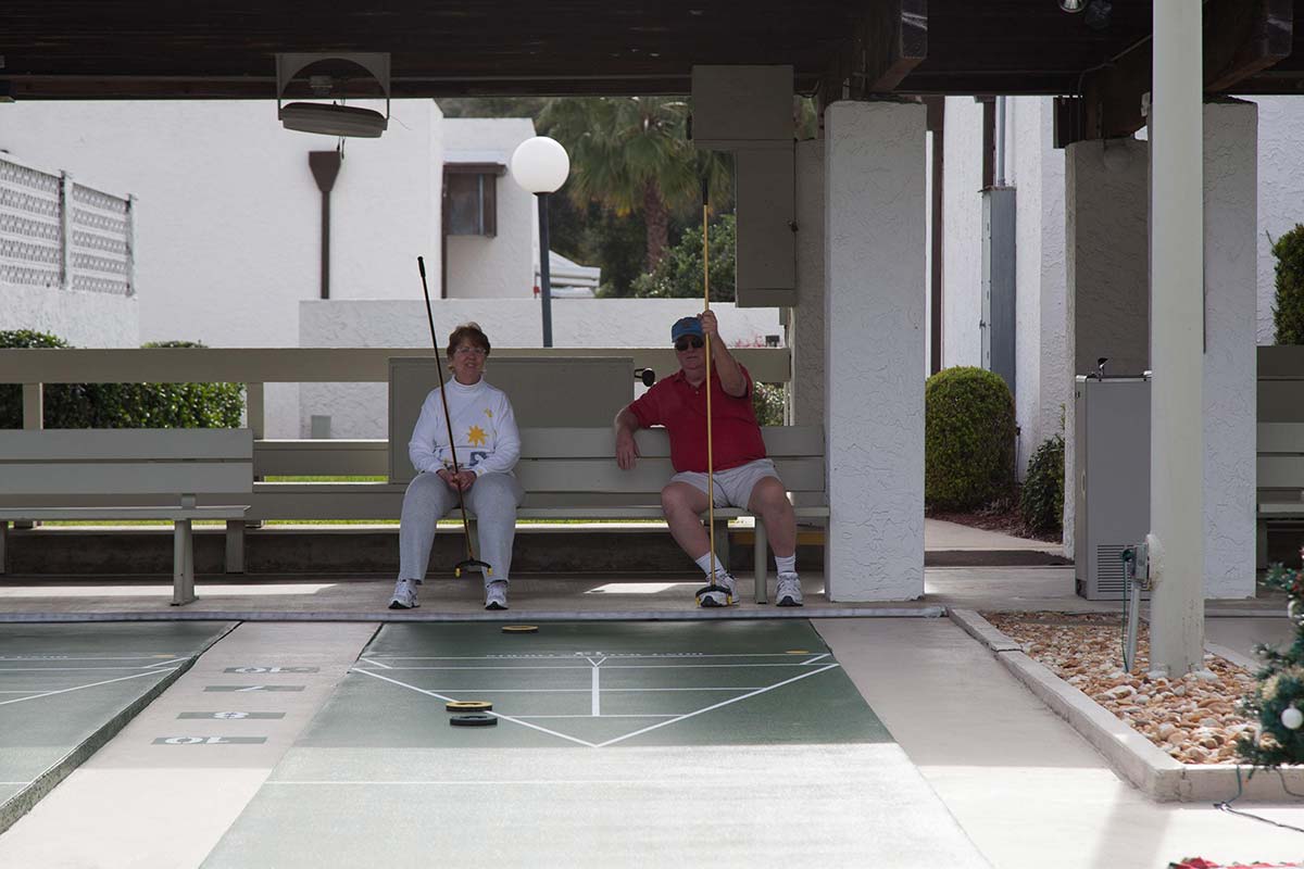 couple playing shuffleboard