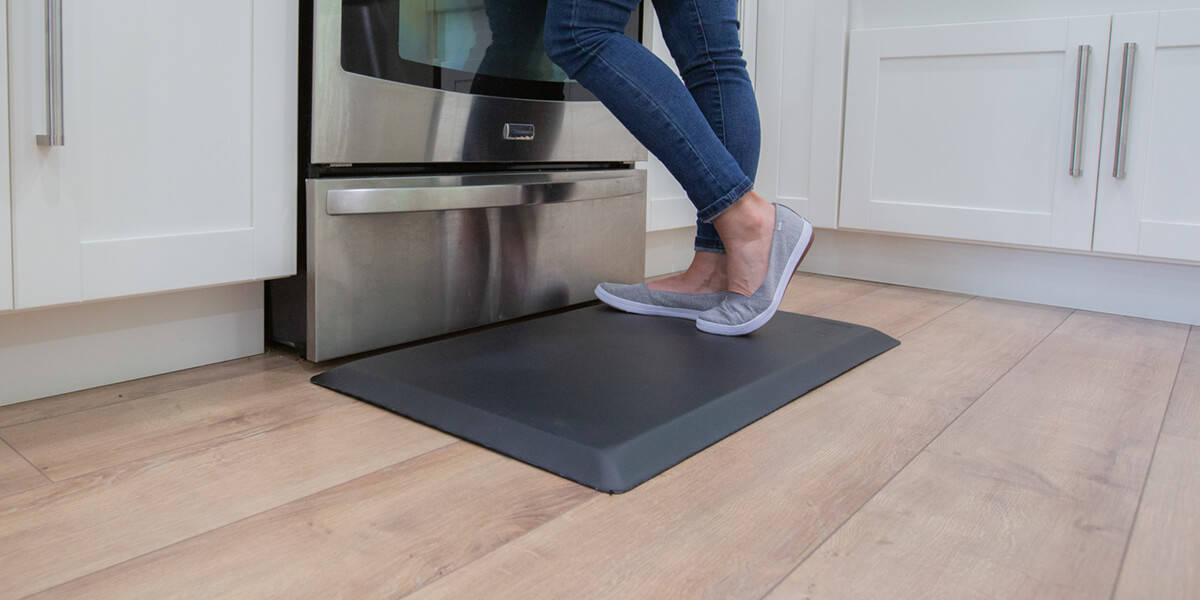 standing on anti-fatigue mat