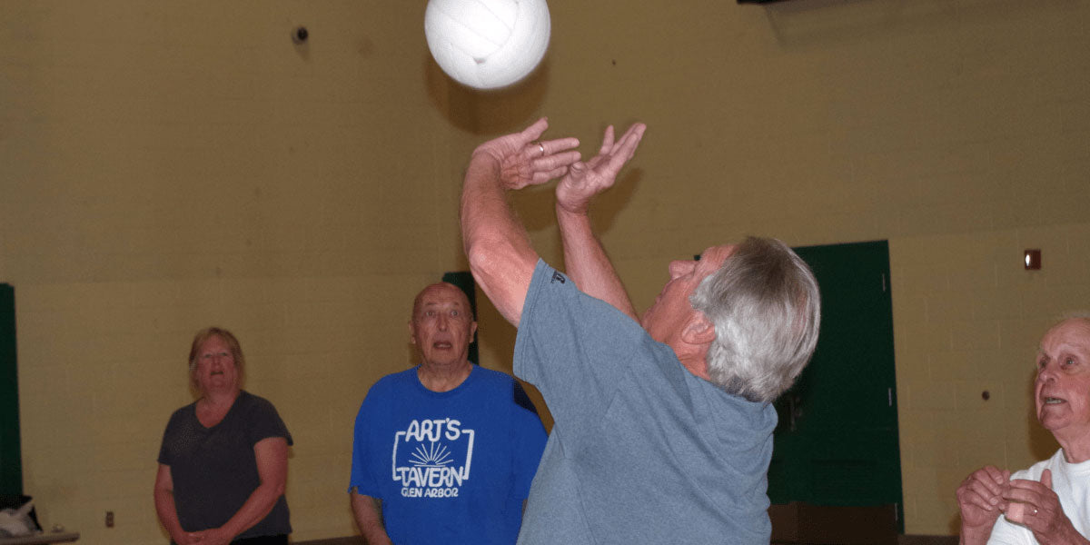 man setting volleyball