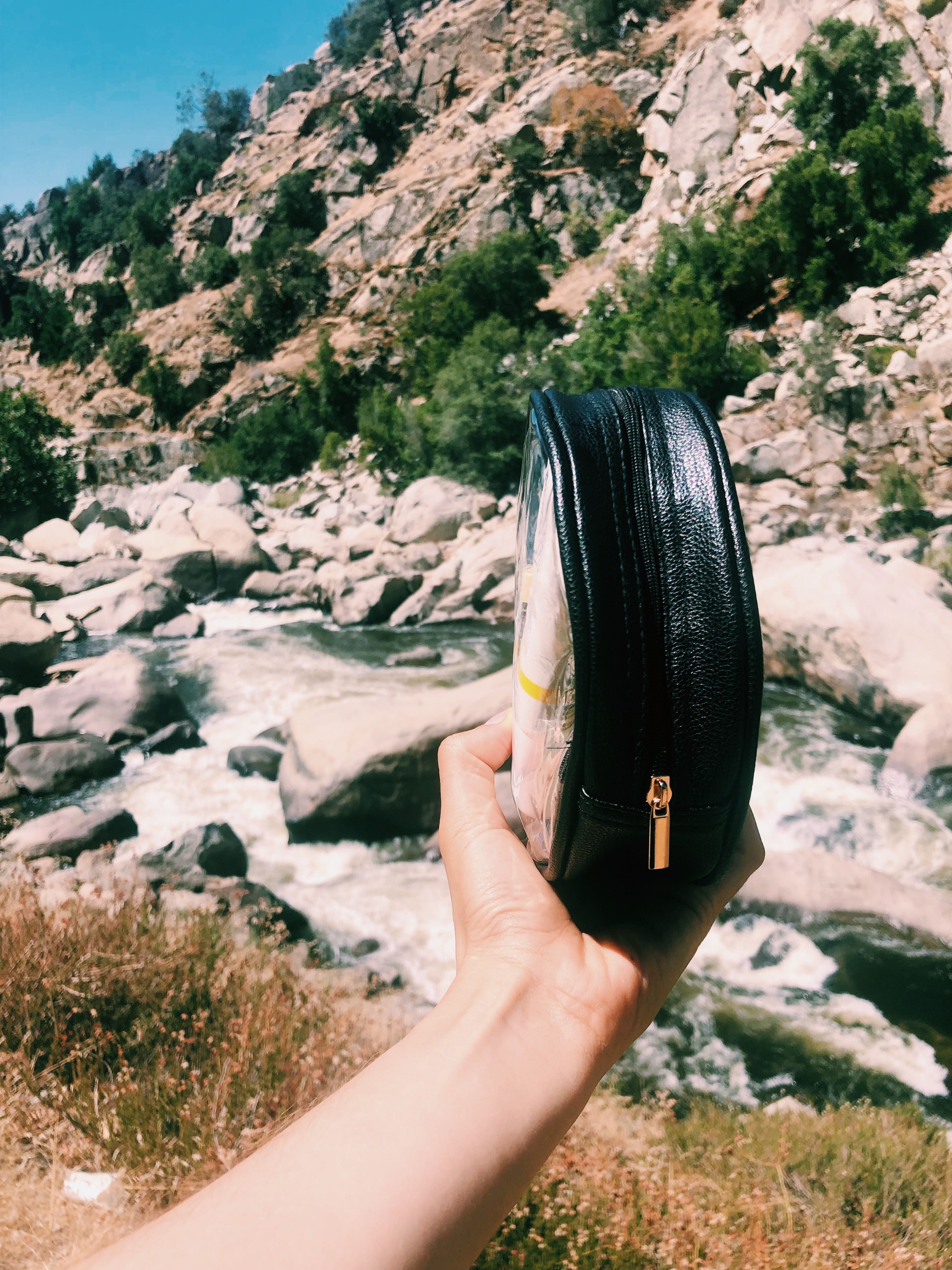 Camping near water with clear black circle pouch