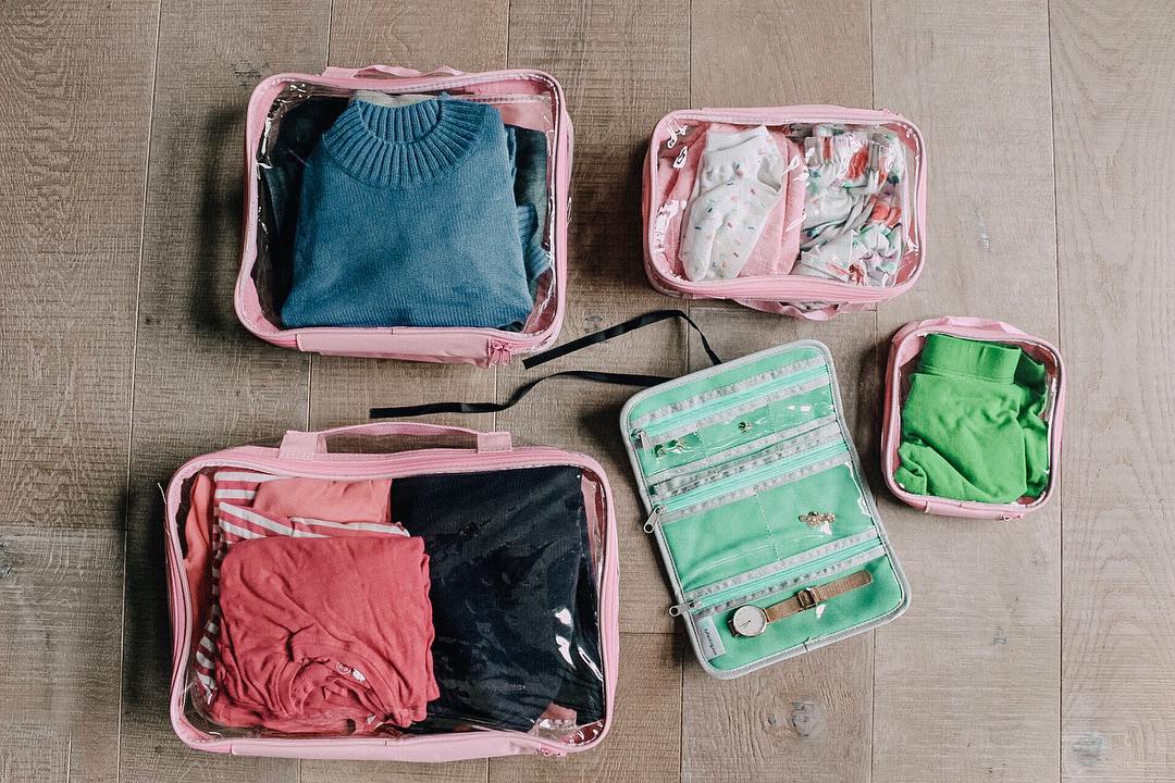 Clothes folded and packed in rose packing cubes