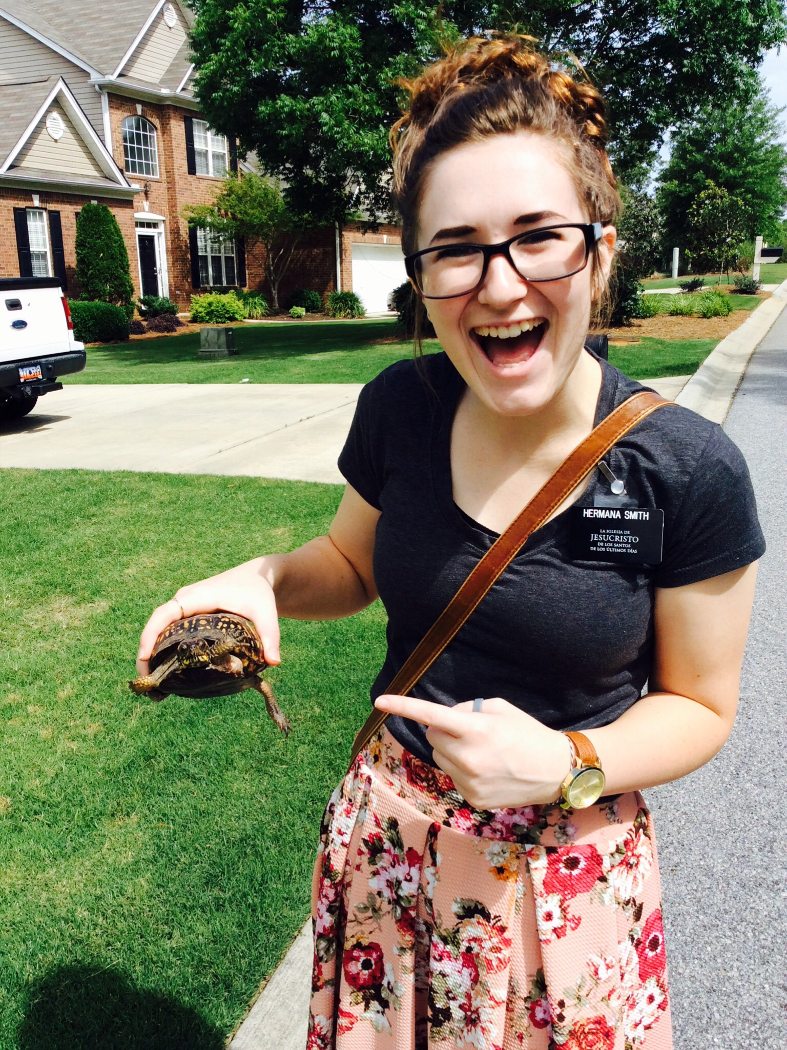 Jesse holding a turtle during her missionary trip