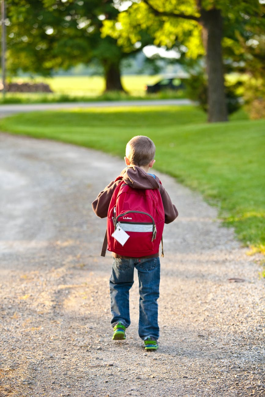 Kid walking during trip with family