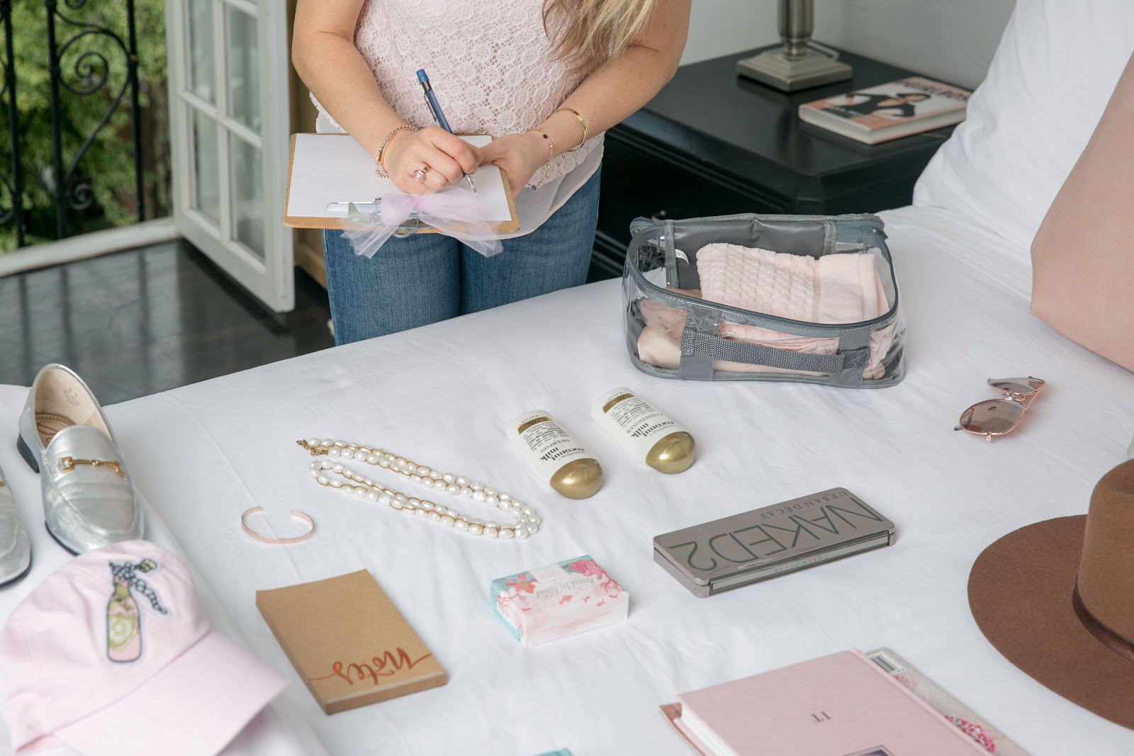 Woman checking packing list for travel