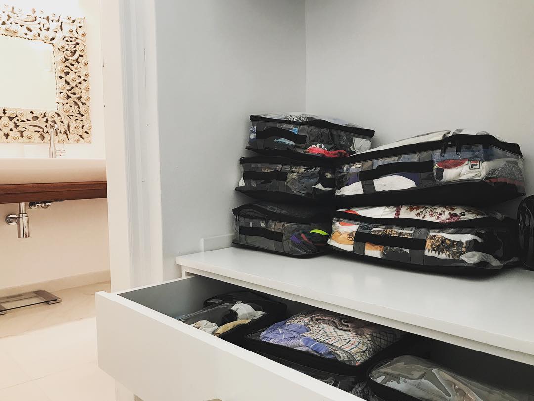 Clean and organized closet with medium packing cubes