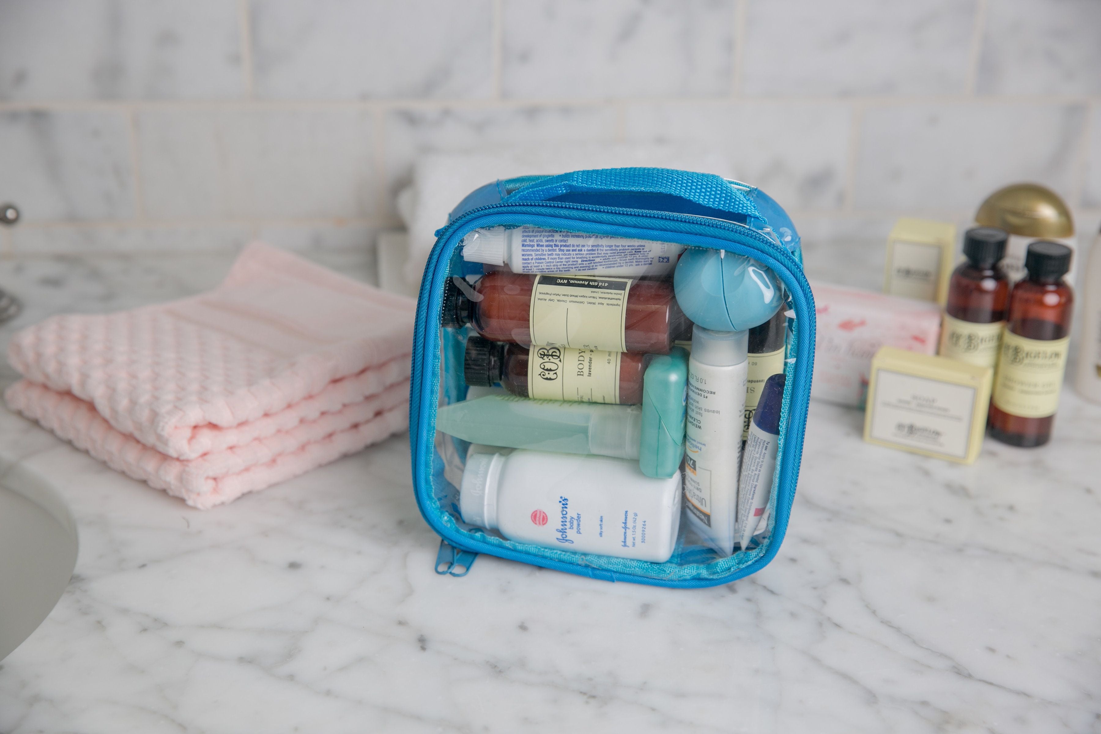 Toiletries in a turquoise extra small cube