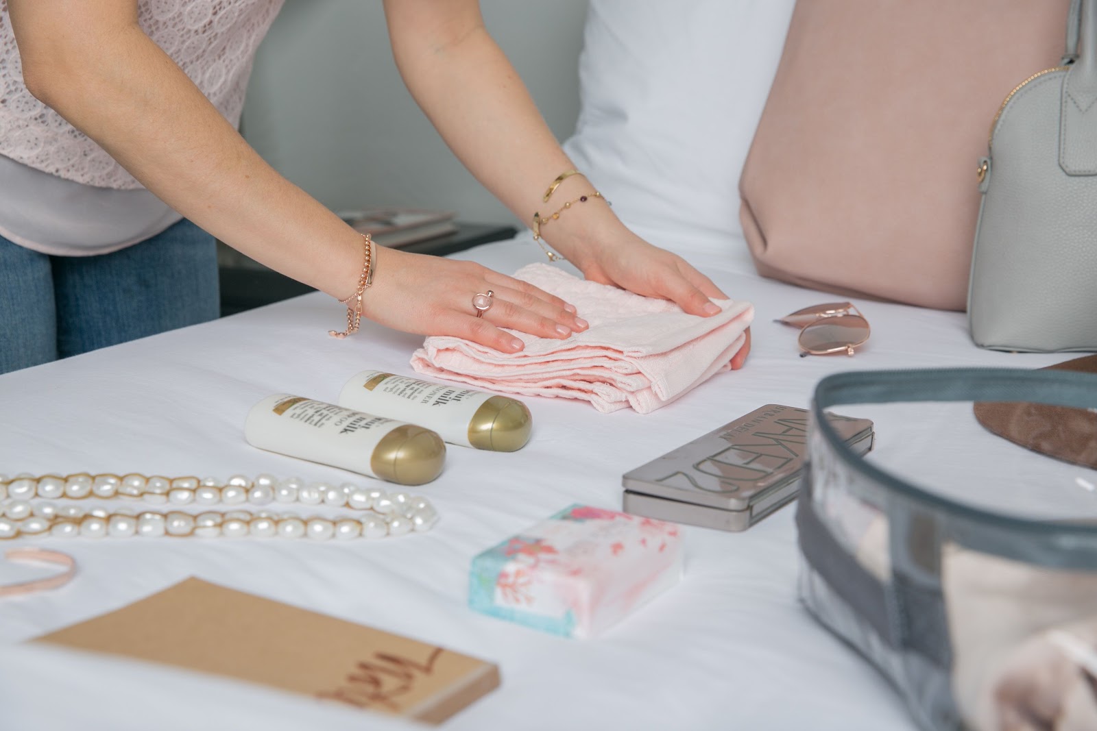 Woman packing clothes in cube