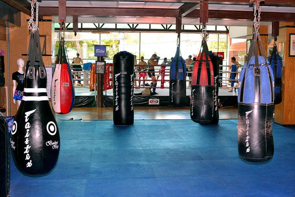 Fairtex Sports Club and hotel training room with punching bags 