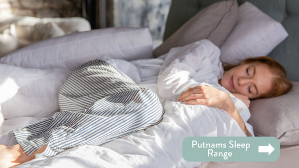 person sleeping in bed with white linen