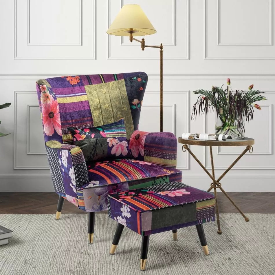 Purple patchwork Victoria accent chair with a footstool from Stunning Chairs on a light background next to a small black table