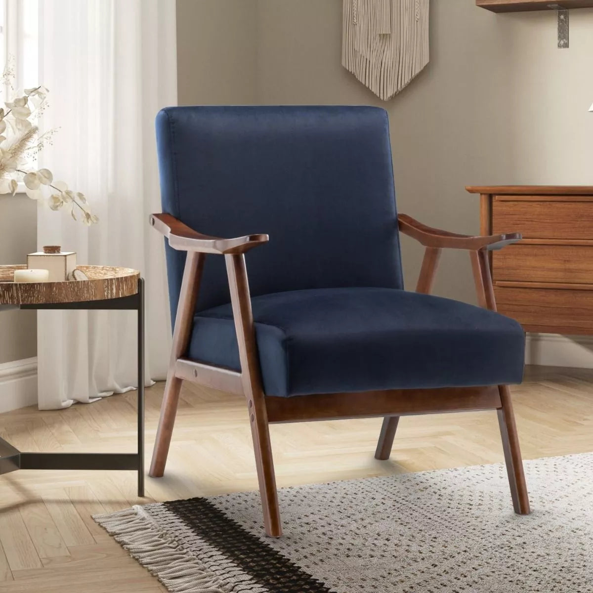 A Navy Blue Velvet Selma chair from Stunning Chairs, pictured on a scandinavian-inspired background