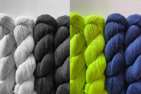 photo of two different colours of yarn in skeins, one is a bright green one is a dark navy, the photo shows the image in colour and black and white