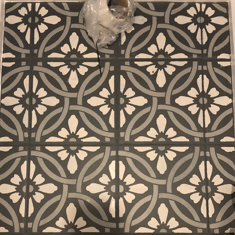 Revamp old floor tiles with a stencil