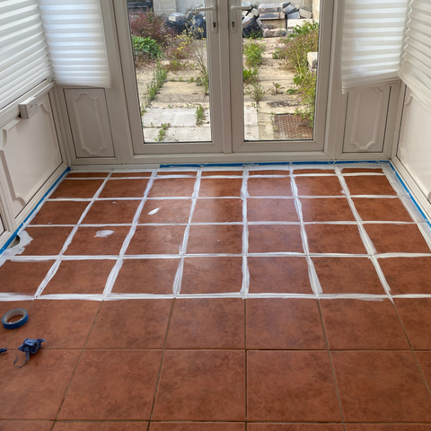 Applying the base coat to the floor