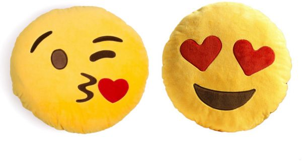 A kiss kiss emoji pillow and a heart eyes emoji pillow.