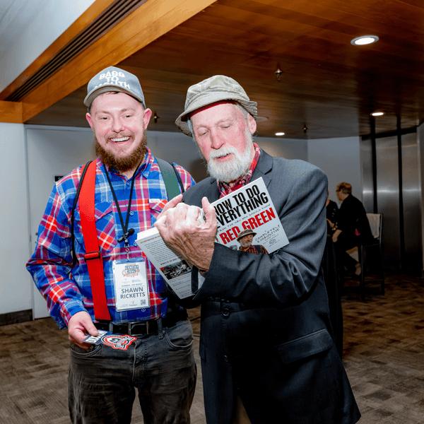 Steve Smith who plays the iconic Red Green, signing a book for fan and Possum Lodge Member, Shaun Ricketts