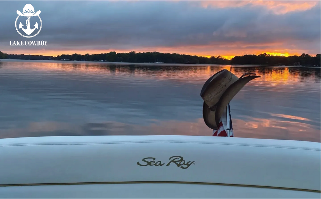 Photo of a beautiful sunset on Lake Minnetonka with a Cowboy Hat and the Lake Cowboy Logo