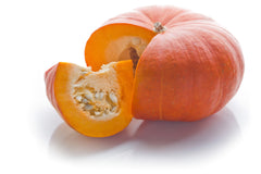 picture of orange pumpkin with slice cut out.