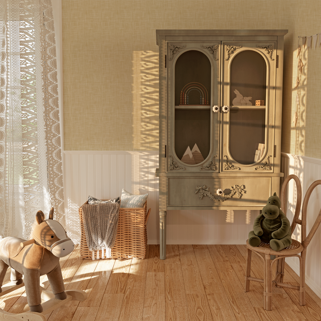 A charming playroom bathed in sunlight, featuring cream linen grasscloth wallpaper that complements the white beadboard and wooden furnishings