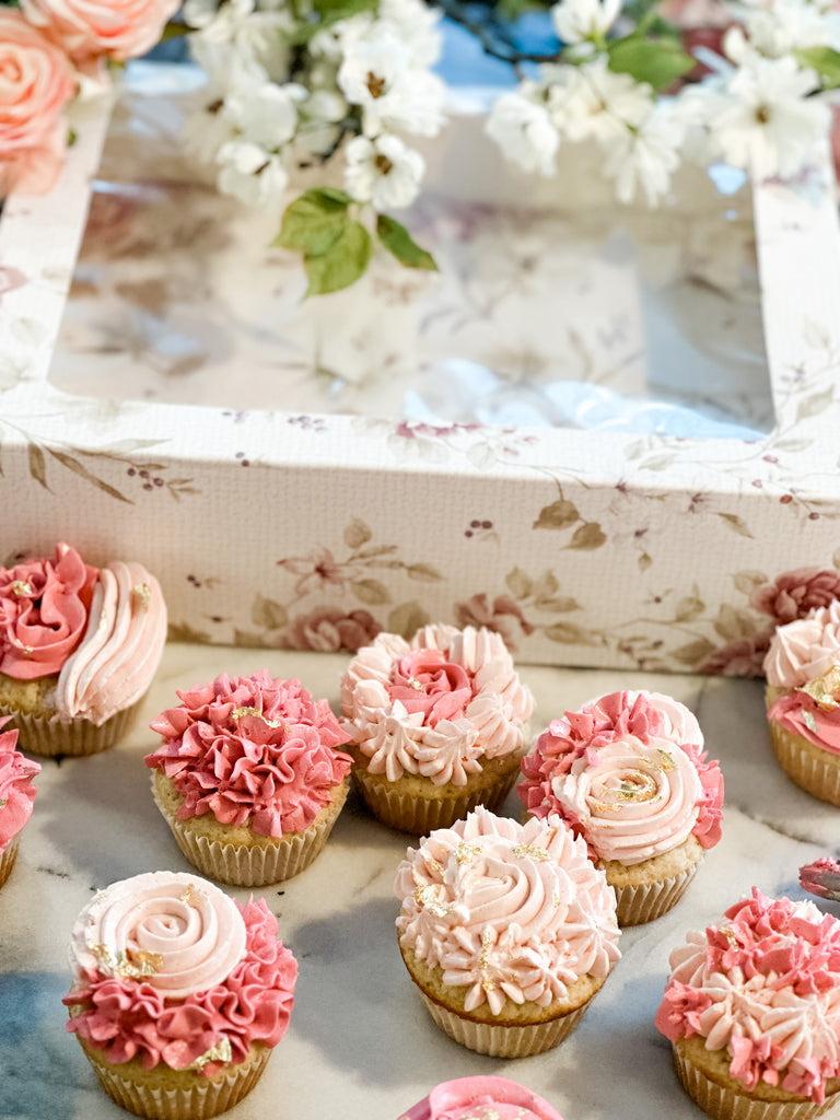 Floral cupcake box and delicious vanilla cupcakes with homemade icing