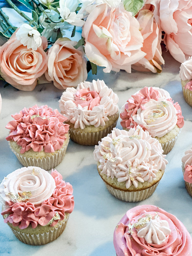 Vanilla cupcakes with delicious pink decorative icing