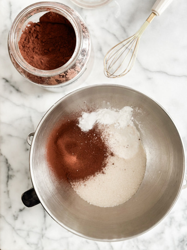 Ingredients for easy delicious chocolate cake or cupcakes in mixing bowl
