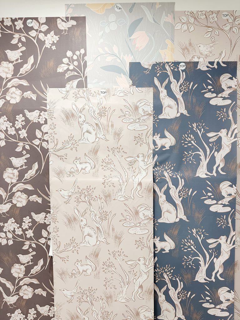 Exclusive wallpaper designs featuring woodland animals in neutral colors