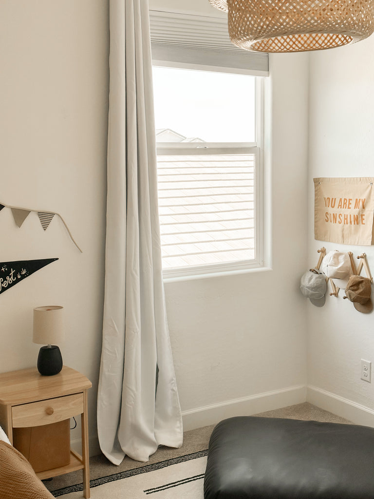 Little boy's bedroom inspo with natural accents and peel and stick wallpaper