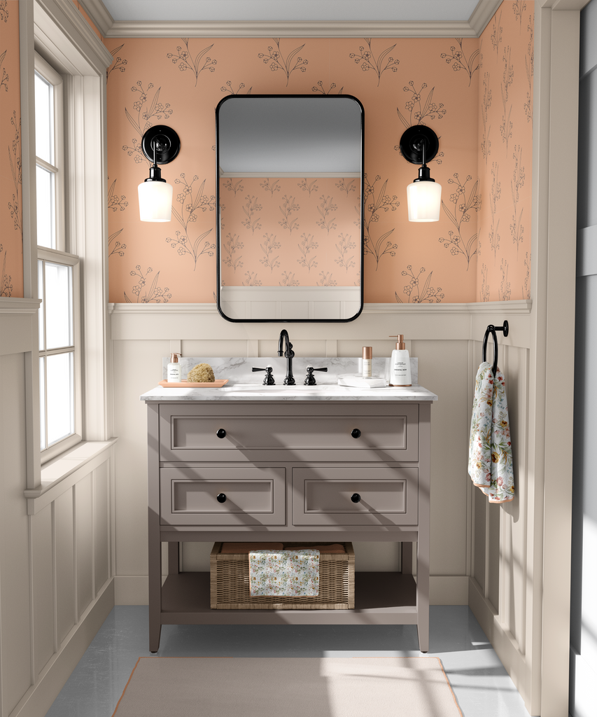 Elegant bathroom enhanced with Peach Fuzz colored wallpaper featuring delicate sketched foliage designs, offering a serene and stylish look.