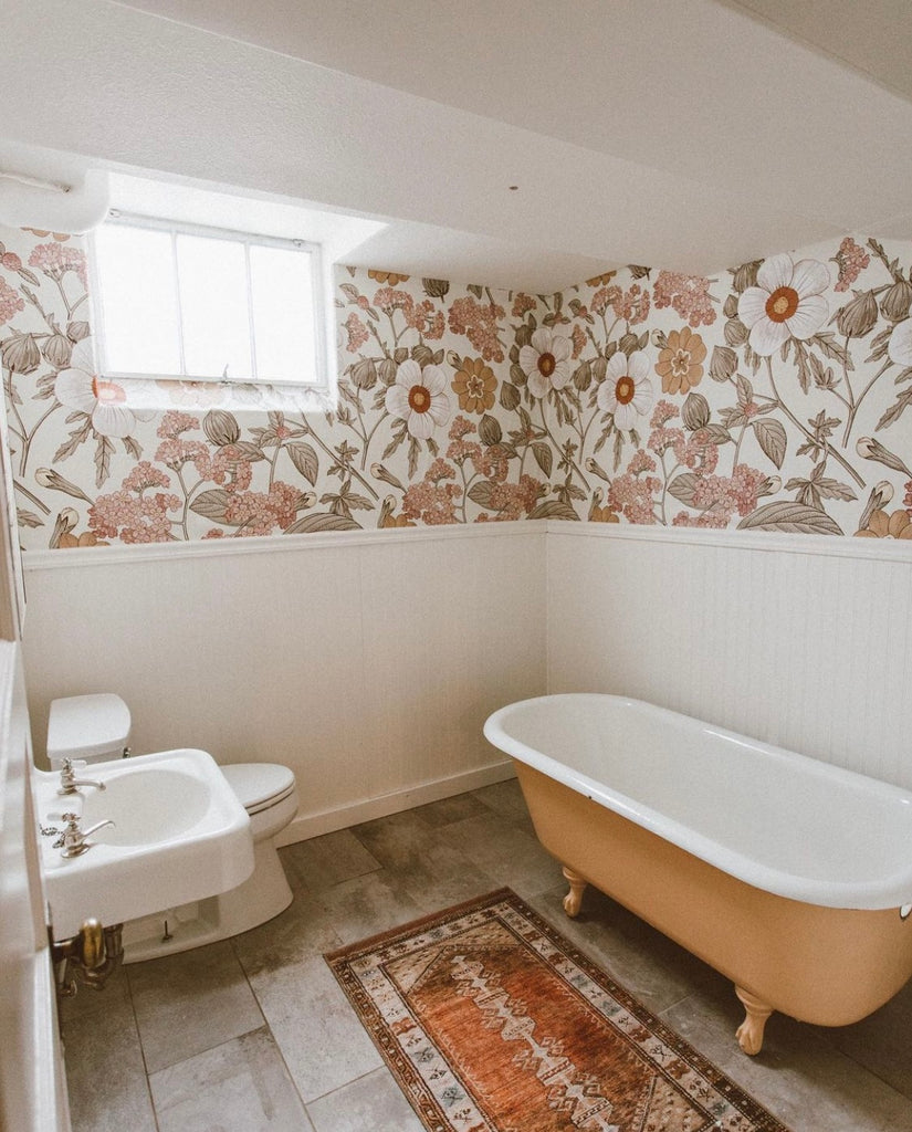 Bohemian style floral peel and stick wallpaper in a retro feel bathroom with soakertub.
