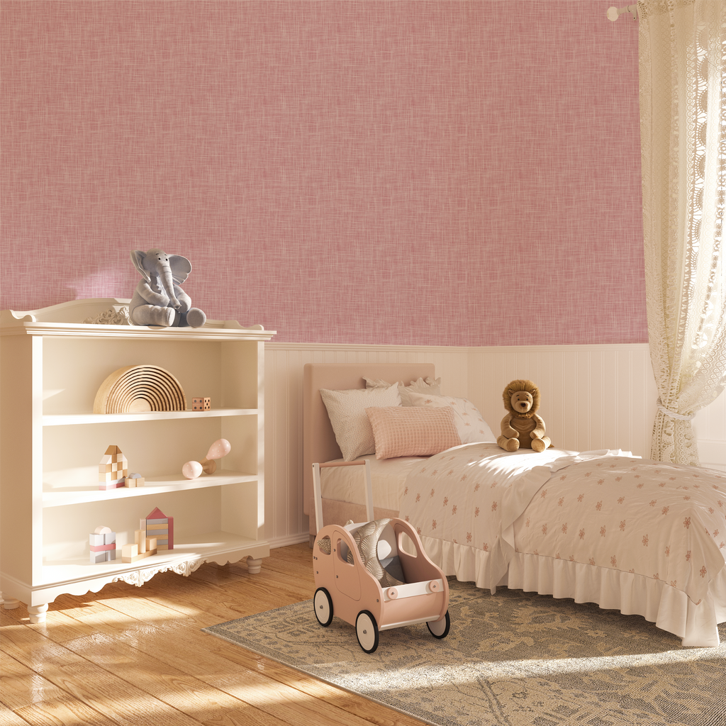 A warm, inviting nursery with soft pink grasscloth wallpaper, enhancing the whimsical and gentle ambiance of the space