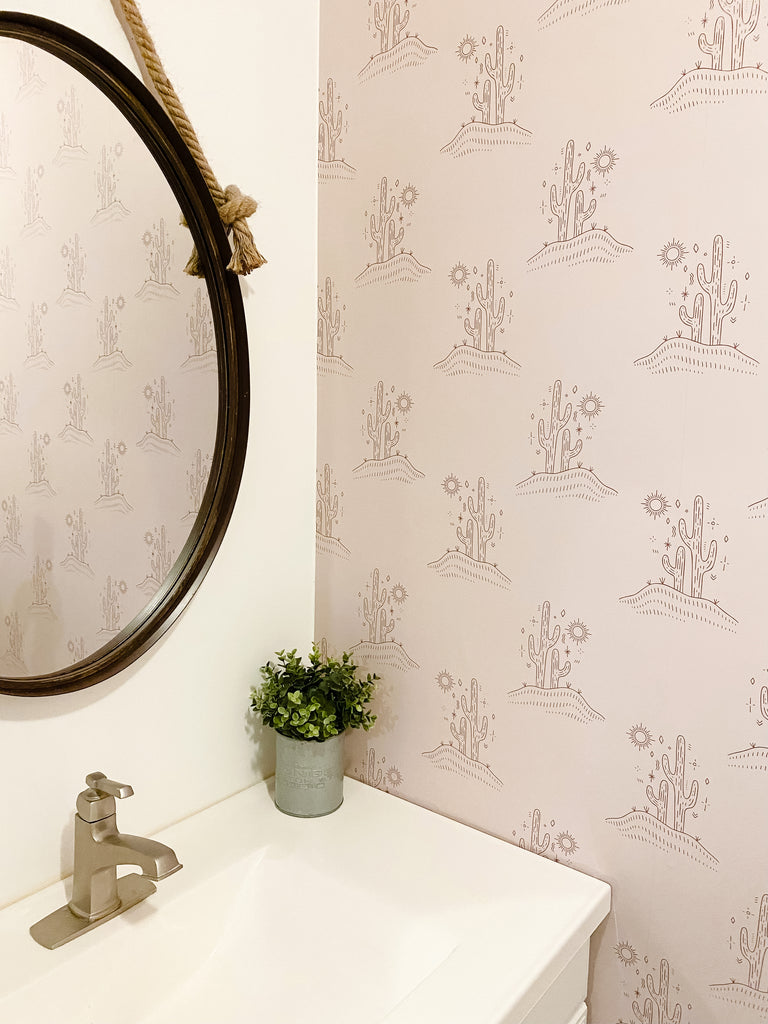 Beautiful bathroom with wallpaper with cactus trees