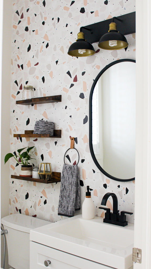 Powder room with Terrazzo design and black accents