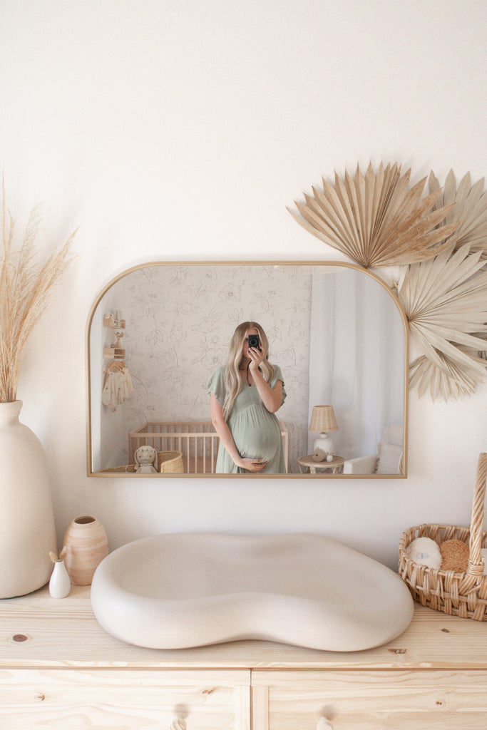 Baby nursery change table with keekaroo change pad and diy pampas grass and leaves