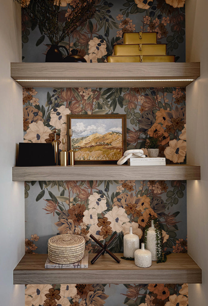 Closet shelving with stunning vintage floral wallpaper as the backdrop