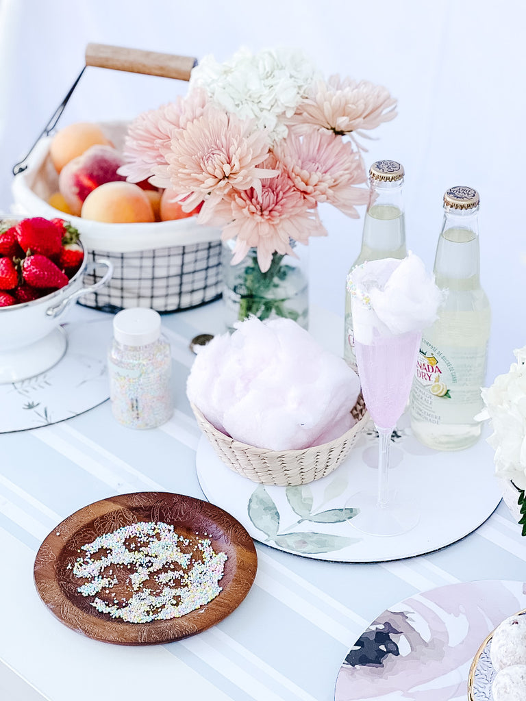 picnic setup with flowers and cotton candy mocktail drink for kids